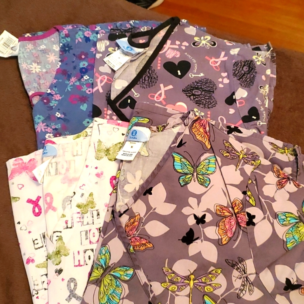 4 scrub shirts